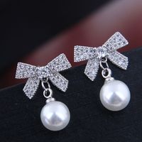 10737 Exquisite Korean Fashion Sweet Ol Flash Diamond Bow Pearl Personality Temperament Earrings main image 2