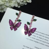 Européen Et Américain Célèbre De Luxe Fée Papillon Boucles D'oreilles Micro Incrusté Zircon Feuilles Fleurs Longue Frange Boucles D'oreilles Digne Déesse main image 5