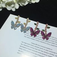 Européen Et Américain Célèbre De Luxe Fée Papillon Boucles D'oreilles Micro Incrusté Zircon Feuilles Fleurs Longue Frange Boucles D'oreilles Digne Déesse main image 6