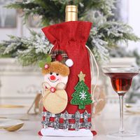New Christmas Decorations Sackcloth Snow Cartoon Drawstring Wine Bottle Cover Lattice Doll Wine Bottle Bag Wholesale sku image 2