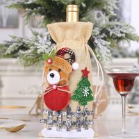 New Christmas Decorations Sackcloth Snow Cartoon Drawstring Wine Bottle Cover Lattice Doll Wine Bottle Bag Wholesale sku image 4