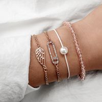 Europäische Und Amerikanische Grenz Überschreitende Neue Schmuck Mode Einfache Diamant Flügel Perlen Reis Perlen Seil Kombination 4-teiliges Armband main image 1