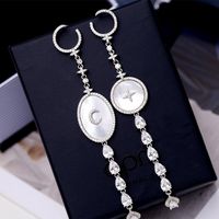 Européen Et Américain Élégant L'industrie Lourde Boucles D'oreilles 925 Argent Aiguille Zircon Shell Gouttes Pour Les Oreilles Personnalité Étoiles Lune Asymétrique Shell Boucles D'oreilles Des Femmes main image 1