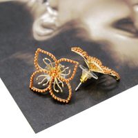 Copper Hollow Flower Millet Grain Beads Alloy Needle Stud Earrings Nhom129455 sku image 1