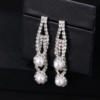 Fabrik Direkt Verkauf Neue Mode Legierung Diamant Ohrringe Europäischen Und Amerikanischen Langen Retro Hohle Perlen Ohrringe Spot main image 4