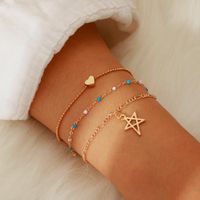 Europäische Und Amerikanische Grenz Überschreitende Neue Schmuck Kreative Einfache Legierung Leere Sterne Reis Perlen Kette 3-lagige Armband Fußkettchen main image 1