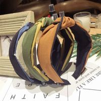 Korean Version Of The Simple Solid Color Fabric Hit Color Middle Knot Knotted Wide Side Headband Nhsm143905 main image 4
