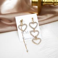 Südkoreas Trend Ige Asymmetrische Diamant Ohrringe Liebes Nähte Lange Süße Schönheits Ohrringe Mit Quaste Hohle Pfirsich Herz Ohrringe main image 5