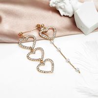 Südkoreas Trend Ige Asymmetrische Diamant Ohrringe Liebes Nähte Lange Süße Schönheits Ohrringe Mit Quaste Hohle Pfirsich Herz Ohrringe main image 4