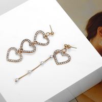 Südkoreas Trend Ige Asymmetrische Diamant Ohrringe Liebes Nähte Lange Süße Schönheits Ohrringe Mit Quaste Hohle Pfirsich Herz Ohrringe main image 7