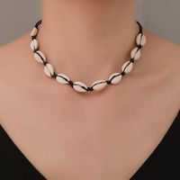 Vente Chaude En Europe Et Amérique Noir Noué Collier Plage Style Naturel Shell Collier De Femmes À La Main-tissé Collier Usine En Gros main image 1