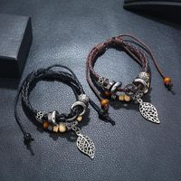 Korean Version Of Imitation Cowhide Bracelet Simple Wild Alloy Leaf Pendant Woven Leather Bracelet main image 3