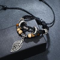 Korean Version Of Imitation Cowhide Bracelet Simple Wild Alloy Leaf Pendant Woven Leather Bracelet main image 4