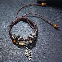 Korean Version Of Imitation Cowhide Bracelet Simple Wild Alloy Leaf Pendant Woven Leather Bracelet main image 5