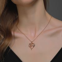 Creative Hollow Heart-shaped Peace Dove Diamond Animal Necklace main image 1