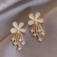 925 Silver Needle White Small Flower Meteor Fashion Earrings main image 1