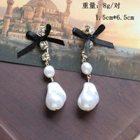 White Special-shaped Pearl Bow Long Stud Earrings main image 3