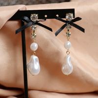 White Special-shaped Pearl Bow Long Stud Earrings main image 5