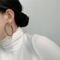 French Retro Large Hoop Handmade Leather Heart Tassel Pendant C-shaped Earrings main image 1
