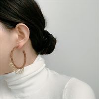 French Retro Large Hoop Handmade Leather Heart Tassel Pendant C-shaped Earrings main image 3