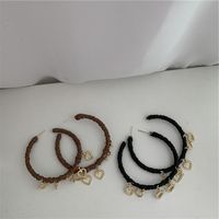 French Retro Large Hoop Handmade Leather Heart Tassel Pendant C-shaped Earrings main image 6