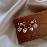 925 Silver Needle Bowknot Pearl Diamond Earrings main image 1