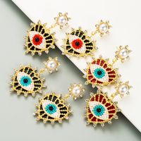 Exquisite Devil's Eyes Diamond-studded Pearl Heart-shaped Earrings main image 2