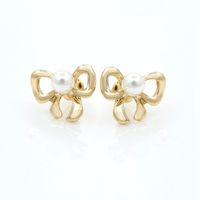 Simple Bow Earrings Gold-plated Silver Inlaid Pearl Earrings 8-shaped Bow Tie Earrings Wholesale main image 5