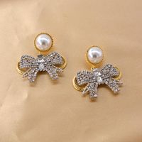 New Baroque Flash Diamond Elegant Pearl Bow 925 Silver Pin Earrings Wholesale main image 1