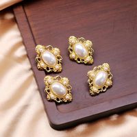 White Engraved Pattern Hollow Pearl Ear Clips 925 Silver Pin Earrings Oval Ear Clips main image 2