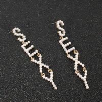 The New Exaggerated Pearl English Alphabet Earrings Wholesale main image 5