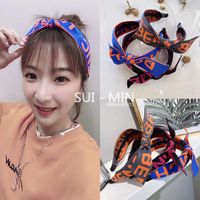 Korean New Fashion Sports And Leisure Wind Letter Logo Wide-brimmed Bowknot Cheap Headband Wholesale main image 1