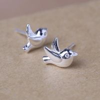 New Simple Flying Pigeon Earrings Alloy Electroplated Three-dimensional Peace Pigeon Earrings Wholesale main image 2