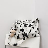 Korean New Simple Lazy Style Cute Cow Polka Dot Student Canvas Bag Class Bag Wild Messenger Bag Wholesale main image 1