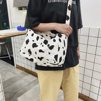 Korean New Simple Lazy Style Cute Cow Polka Dot Student Canvas Bag Class Bag Wild Messenger Bag Wholesale main image 4