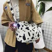 Korean New Simple Lazy Style Cute Cow Polka Dot Student Canvas Bag Class Bag Wild Messenger Bag Wholesale sku image 2