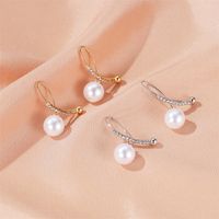 New Ear Clip Earrings Temperament Pearl Cross Earrings Ladies Sweet Wild Diamond Inlaid Earring Wholesale Nihaojewelry main image 3