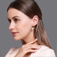 Korean Fashion Earrings Temperament Commuter Pearl Cross Earrings Small Fresh Sweet Wild Diamond Earrings Wholesale Nihaojewelry main image 1