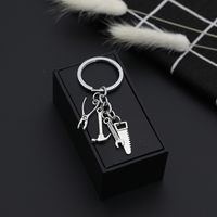Explosion Keychain Personality Father's Day Gift Tool Four-piece Metal Keychain Pendant Jewelry Wholesale Nihaojewelry main image 4