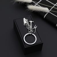 Explosion Keychain Personality Father's Day Gift Tool Four-piece Metal Keychain Pendant Jewelry Wholesale Nihaojewelry main image 6
