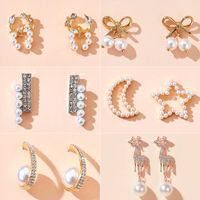 Korean Style Asymmetry Stars Elk Bow Pearl Earrings Simple Spread Wholesale Nihaojewelry main image 1