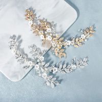 New Bridal Jewelry Pearl Crystal Hair Band Metal Leaves Hand Comb Soft Ceramic Flower Hair Comb Wholesale Nihaojewelry main image 1