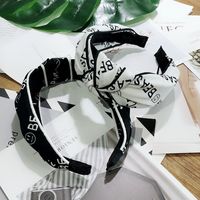 Korean Fashion Wide-brimmed Letter Printing Clip Knotted Headband High-end Wild Fashion Hairpin Temperament Hair Headband Ladies Wholesale Nihaojewelry main image 5