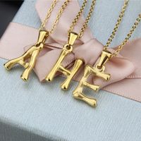 Platform New Stainless Steel Antique Slub-shaped 26 Letter Necklace Hot Gold English Titanium Steel Pendant Wholesale Nihaojewelry main image 1