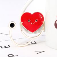 Hot Creative Cartoon Medical Heart-shaped Stethoscope Oil Drop Corsage Accessories  Wholesale Nihaojewelry main image 6