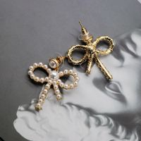 Hersteller Liefern Hohle Schleifen Silberne Nadel Ohrringe Kleine Perlen Elegante Schleifen Ohrringe Süße Ohrringe main image 3