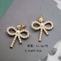 Hersteller Liefern Hohle Schleifen Silberne Nadel Ohrringe Kleine Perlen Elegante Schleifen Ohrringe Süße Ohrringe main image 4