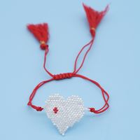 Pulsera De Estilo Étnico Con Borla De Amor Tejida A Mano Con Cuentas De Arroz En Caliente Para Mujer sku image 2