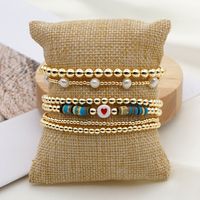 Fashion Trend Natural Pearl Soft Ceramic Multi-layered Beaded Imported Color-preserving Gold Bead Letter Bracelet main image 1