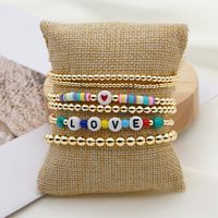 Fashion Trend Natural Pearl Soft Ceramic Multi-layered Beaded Imported Color-preserving Gold Bead Letter Bracelet main image 2